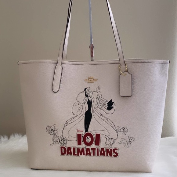 Coach Handbags - NWT Coach Disney X Coach City Tote with Signature Canvas Interior Cruella Motif